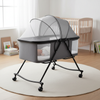 Foldable Aluminum Alloy Baby Crib with Removable Mattress in a modern nursery setting with a sleeping baby.