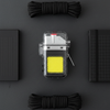 Mini Keychain LED Flashlight & Lighter surrounded by black ropes and notebooks on a gray background.