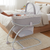 Deluxe 2 in 1 Bassinet & Moses Basket with baby inside, designed for comfort and safety in modern bedrooms.