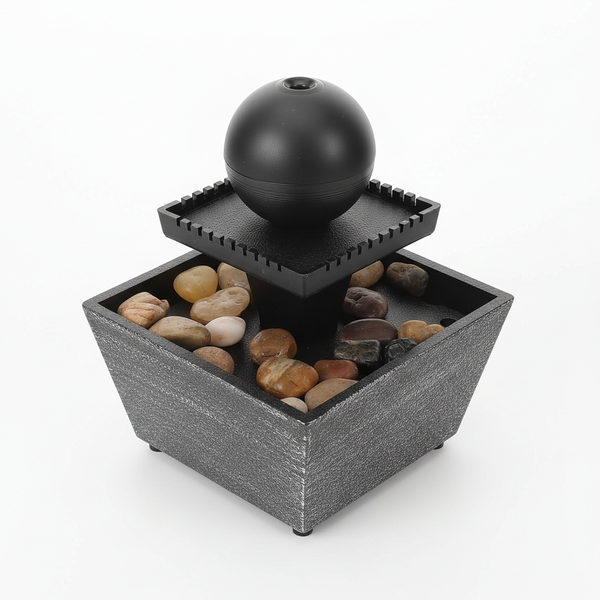 Indoor Tabletop Water Fountain Decor with pebbles and a sphere on top for a calming home atmosphere.