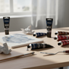 Acrylic Paint 75ml - Black tube among various colors, with a palette and brush on a desk for creative projects.