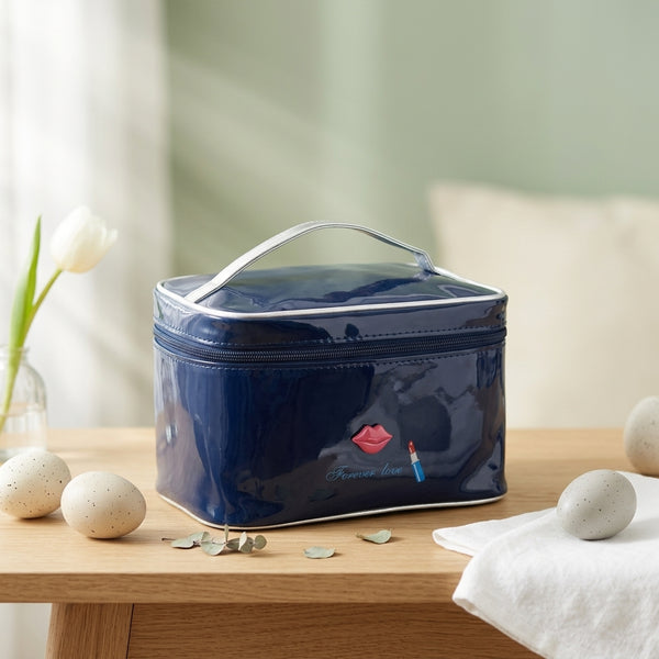 Patent Leather Hand-Held Toiletry Bag in navy blue with a stylish design, perfect for organizing makeup essentials.