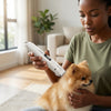 Person using USB Rechargeable Professional Pet Grooming Trimmer on a small dog in a cozy indoor setting.