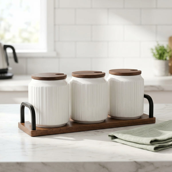 Ceramic Seasoning Jar Set with Wooden Tray on a kitchen counter with green napkin and modern decor.