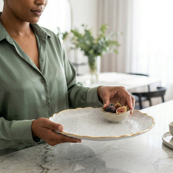 European Vintage Dinner Plate held by a person, showcasing elegant ceramic decor with a detailed edge.