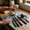 5 Piece Professional Antibacterial Kitchen Chef Knife Set displayed with fresh ingredients on a kitchen countertop.