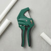 42mm PVC Pipe Cutter Tool on a gray surface with white PVC pipes, designed for clean and precise cuts.