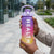 4-in-1 Motivational Gradient Water Bottle Set in hand, promoting healthy hydration with vibrant gradient design.