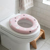 Baby Cushion Potty Seat with Print on a toilet, featuring a pink floral design for toddlers.