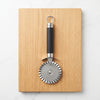 Eco-Friendly Kitchen Pizza Cutter on a wooden board, designed for efficient and organized cooking.