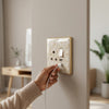 Golden 3-Pin UK Standard Waterproof Wall Socket with a user plugging in a device.