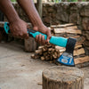Person using a 600g Ergonomic Camping Hatchet to chop wood, showcasing its fiberglass handle and effective blade design.