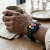 Waterproof Bluetooth Fitness Smartwatch displaying time and colorful interface, worn on a wrist while holding a cup.