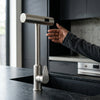 Flexible Pull Down Deck Mounted Kitchen Faucet in a contemporary kitchen setting.