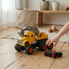 Remote Control Construction Engineering Excavator Truck toy in use with remote control and wooden blocks.