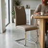Cantilever Chrome Bar Stool with Backrest in a modern kitchen setting, designed for comfort and style.