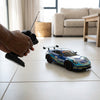 Scale RC Drift Car 4WD High Speed being controlled with a remote in a living room setting.