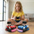 Child playing with 2.4G RC Ejection Bumper Car Twin Pack, featuring red and blue bumper cars and remote controller