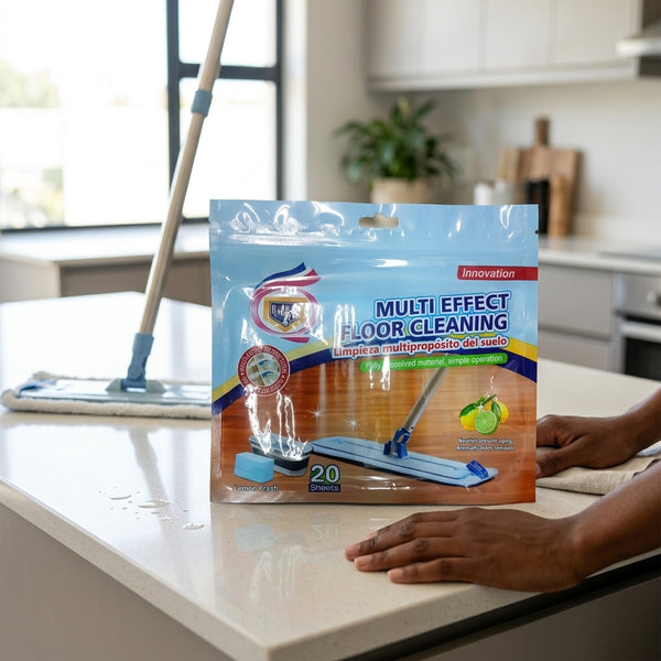 Multi-Effect Eco-Friendly Hard Floor Wipes package on a kitchen counter with a cleaning mop for effective floor cleaning.