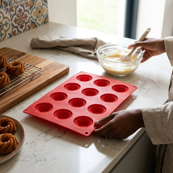 Heart Shape Silicone Baking Mold in red being used to prepare delicious desserts in a cozy kitchen setting.