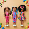 Three 13-Inch Lifelike Black Girl Fashion Dolls in colorful outfits surrounded by building blocks.