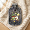 2L Hot Water Bottle with Plush Cover featuring a cute design on a cozy blanket.