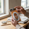 3M Flexible Aluminum Curtain Wire Cord packaging held by a person near a window with measuring tape.