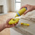 Heavy Duty Chalk Line Reel Kit in use, demonstrating liquid filling process for precise measurements.