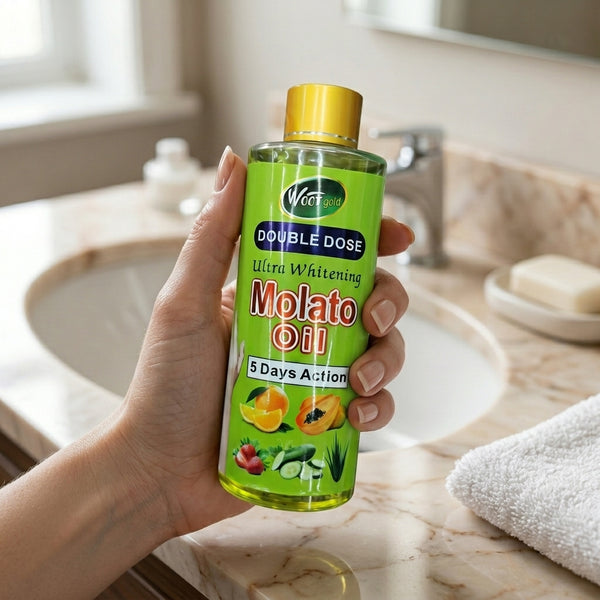 Double Dose Molato Skin Brightening Oil bottle held in a hand near a bathroom sink.