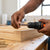 Person using Hexagonal Quick Transfer Batch Head to change drill bits while working on a wooden project.