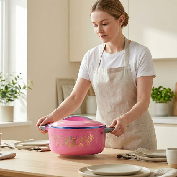 Woman placing a stylish Insulated Stainless Steel Thermal Food Warmer on a dining table while preparing for a meal.