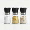 Stainless Steel Salt and Pepper Grinder set with three jars containing salt, spices, and seasonings.