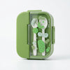 3 Compartment BPA Free Microwave Bento Lunch Box with green utensils stored inside.
