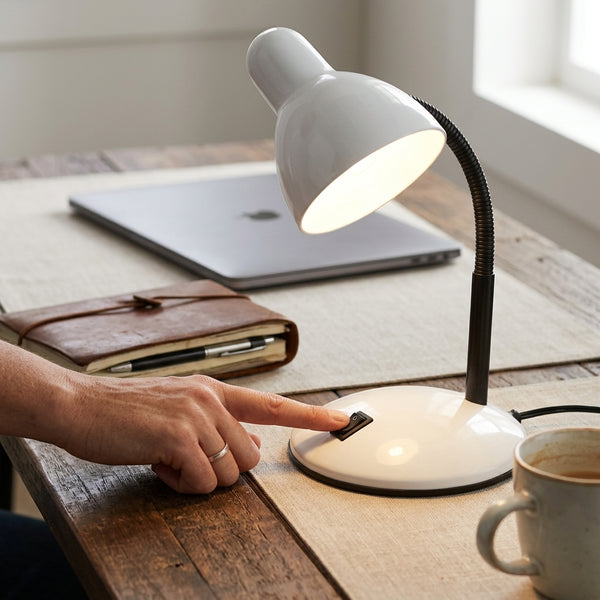 Flexible Gooseneck Desktop Table Lamp providing adjustable lighting on a workspace with a cup of coffee.