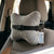 Ergonomic Memory Foam Car Headrest Pillow attached to a car seat for neck support during commutes.
