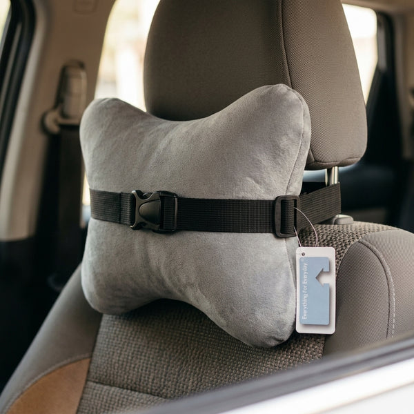 Ergonomic Memory Foam Car Headrest Pillow attached to a car seat for neck support during commutes.