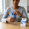 Person applying the Athletic Stretch Elastic Self Adhesive Medical Bandage while sitting at a table.