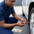 Person using Tubeless Tire Repair Rubber Fixing Strips 10s to fix a punctured tire.