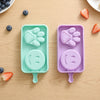 Silicone Paw and Smiley Face Ice Cream Moulds for fun homemade frozen treats in playful shapes.