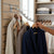 Wall Mounted Metal Multi-functional Waterfall Hook displaying various garments for easy access and organization.