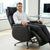 Man sitting in an Executive Genuine Leather Reclining Office Chair in a modern office setting.