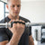 Man using Ergonomic Anti-Slip Rubber Workout Grips with a barbell for improved grip and comfort during workouts.