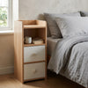 Contemporary Wooden Bedside Table with 2 Drawers beside a bed, featuring two drawers and an open shelf for storage.