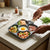 5-in-1 Non-Stick Sandwich & Snack Maker with various ingredients ready to cook on a countertop.