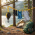 Portable Retractable Clothes Drying Line with clothes drying near a campsite by a lake.