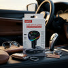 Bluetooth Car MP3 Player FM Transmitter packaging displayed inside a car with various accessories.