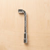 Pipe Socket Wrench L-Shaped tool for automotive repair on a wooden surface.
