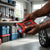 20000mah All in One Emergency Vehicle Jump Starter Pack in a person's hands, showcasing its multi-functional features.