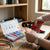 Person using a Mini Multi Cord End Hand Insulated Crimping Tool on a wire with a terminal connector kit nearby.