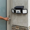 High Brightness 74 LED Solar Wall Light installed beside a door for enhanced outdoor lighting.